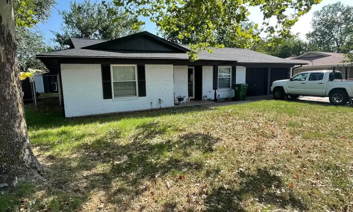 Professional roofing crew working on a residential roof in Arizona City